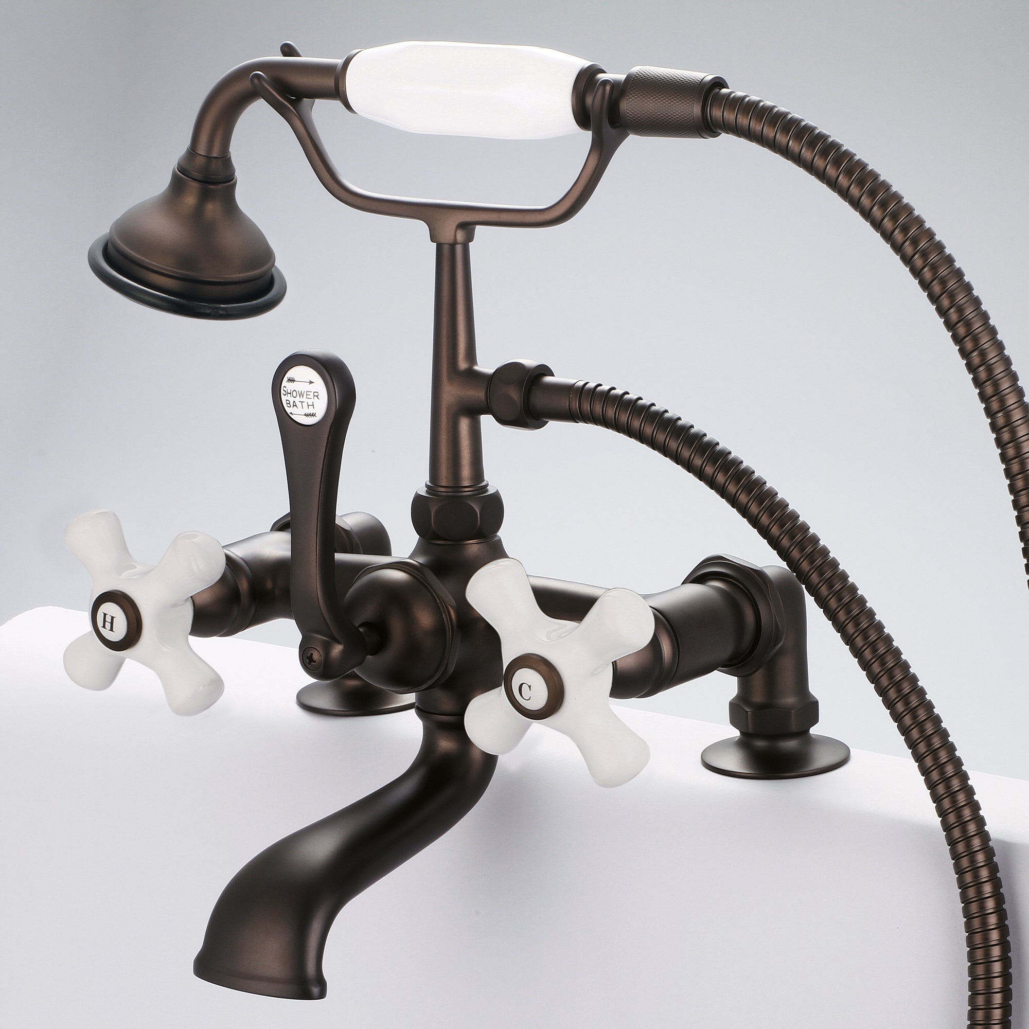 Water Creation | Vintage Classic 7 Inch Spread Deck Mount Tub Faucet With 2 Inch Risers & Handheld Shower in Oil-rubbed Bronze Finish Finish With Porcelain Cross Handles, Hot And Cold Labels Included | F6-0007-03-PX Water Creation | Vintage Classic 7 Inch Spread Deck Mount Tub Faucet With 2 Inch Risers & Handheld Shower in Oil-rubbed Bronze Finish Finish With Porcelain Cross Handles, Hot And Cold Labels Included | F6-0007-03-PX